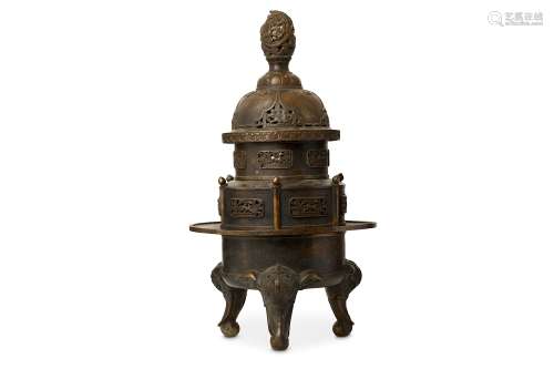 A LARGE CHINESE BRONZE TRIPOD INCENSE BURNER. Cast with a deep basin rising to a wide rim, supported