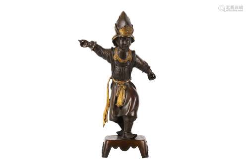 A BRONZE FIGURE OF A CHINESE BOY. 19th/20th Century. Standing wearing a helmet and a cuirass, with