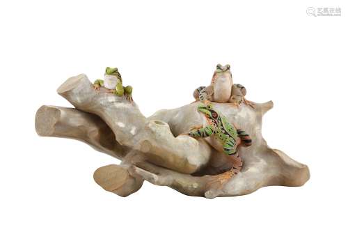 A WOOD OKIMONO OF FROGS ON A TREE TRUNK. 20th Century. Naturalistically carved from a single block