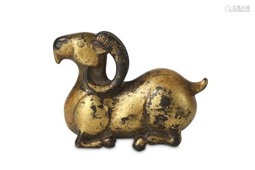 A CHINESE GILT-BRONZE 'RAM' PAPERWEIGHT. Reclining, with his legs tucked underneath the body, his