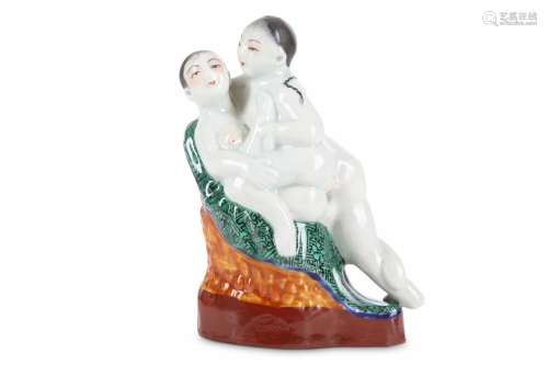 A CHINESE FAMILLE ROSE EROTIC GROUP. Qing Dynasty. Formed as a couple making love on an armchair,