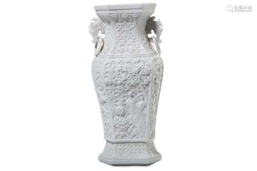A CHINESE MOULDED HEXAGONAL SECTION DEHUA VASE. Qing Dynasty. With a baluster-shaped body