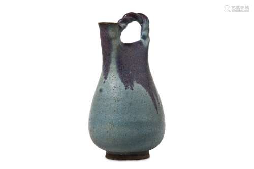 A CHINESE JUN YAO EWER. The pear-shaped body decorated with a pale blue glaze with a lavender splash