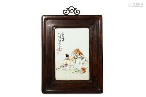 A CHINESE FAMILLE ROSE PORCELAIN PANEL. Painted with four sages in a landscape, inscribed and