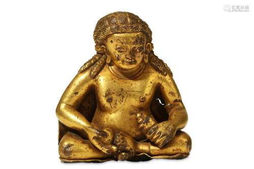 A GILT-BRONZE FIGURE OF JAMBHALA. Qing Dynasty or earlier. Seated with his legs crossed, holding