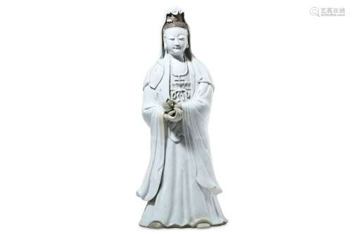 A CHINESE BLANC-DE-CHINE FIGURE OF GUANYIN. Qing Dynasty. Standing, wearing long flowing robes and a