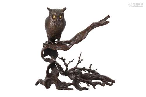 A BRONZE OKIMONO OF AN OWL. 19th Century An owl perched on a gnarled plum tree, the eyes in gilt