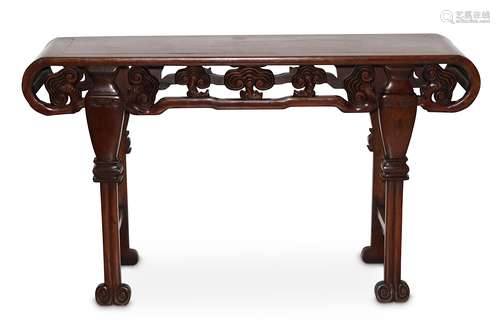 A CHINESE WOOD ALTAR TABLE. Late Qing Dynasty. The rectangular top with curved ends carved with