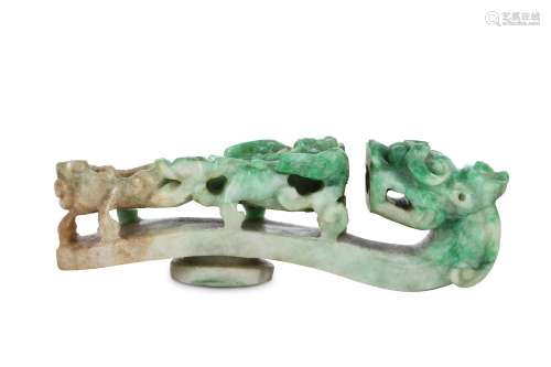 A CHINESE JADEITE 'DRAGON' BELT HOOK. Qing Dynasty. The tip carved as a dragon head, the body with a