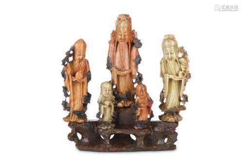 A CHINESE SOAPSTONE CARVING OF IMMORTALS. Late Qing Dynasty. Carved as a group of three sages and