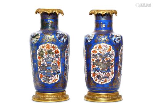 A PAIR OF CHINESE CLOBBERED ROULEAU VASES.   Qing Dynasty. Each painted in enamels and gilt with