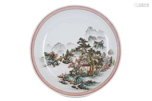 A CHINESE FAMILLE ROSE 'LANDSCAPE' DISH. 20th Century. Painted with figures in a mountainous village