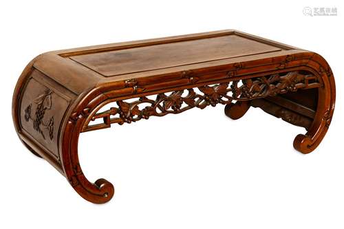 A CHINESE HARDWOOD LOW TABLE. Early 20th Century. Set with incised panels of fruiting vines, with