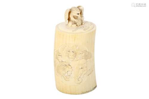AN IVORY BOX AND COVER. Meiji Period. Carved in low relief with tigers, lions, elephants and monkeys