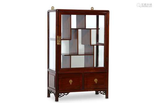 A SMALL CHINESE WOOD CABINET.  Late Qing Dynasty. The upper tier with glass door and an