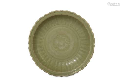 A CHINESE LONGQUAN CELADON CHARGER. Ming Dynasty. The stoutly potted body with lobed rounded sides