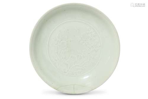 A CHINESE INCISED WHITE-GLAZED DISH. Qing Dynasty, six character Qianlong mark and of the period.
