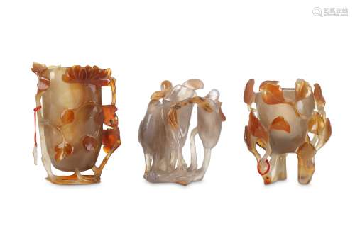 THREE CHINESE CARNELIAN AGATE VASES. 19th / 20th Century. Two carved as deep blossoms caged in