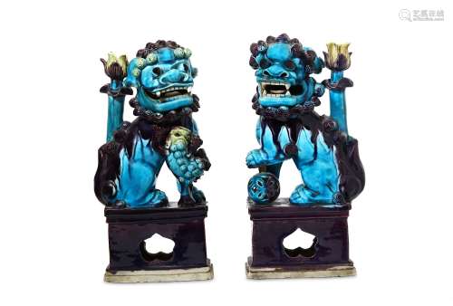 A PAIR OF CHINESE BLUE AND AUBERGINE-GLAZED 'BUDDHIST LION DOG' JOSS STICK HOLDERS. Qing Dynasty.