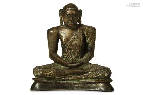 A SOUTHEAST ASIAN BRONZE FIGURE OF A BUDDHA. 19th/20th Century. Seated in a meditating pose, wearing