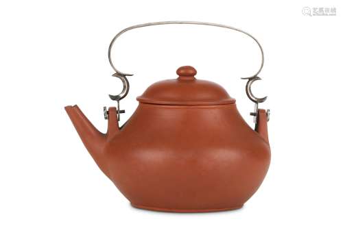 A CHINESE SILVER-HANDLED YIXING ZISHA TEAPOT AND COVER.  The compressed pear-shaped body with a