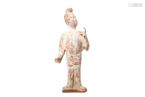 A CHINESE UNGLAZED STANDING FIGURE. Tang Dynasty.