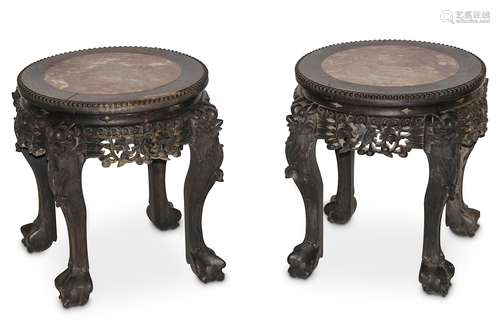 TWO CHINESE WOOD STANDS WITH MARBLE TOPS. Late Qing Dynasty. The circular tops set with stone