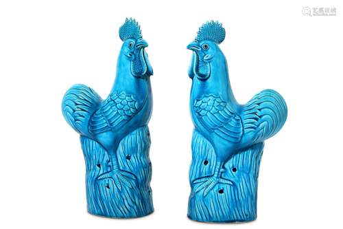 A PAIR OF CHINESE TURQUOISE-GLAZED COCKERELS. Qing Dynasty. Each standing, with the head slightly