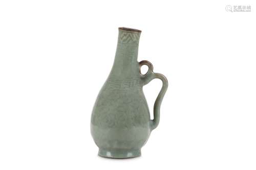 A CHINESE CELADON EWER. With a pear-shaped body and a double handle, incised with stylised clouds