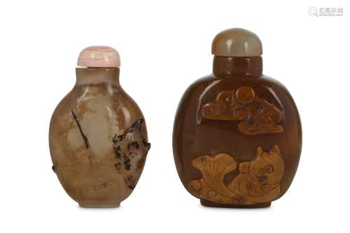 TWO CHINESE 'FISH' AGATE SNUFF BOTTLES. Qing Dynasty. Each with a flattened ovoid body, one carved