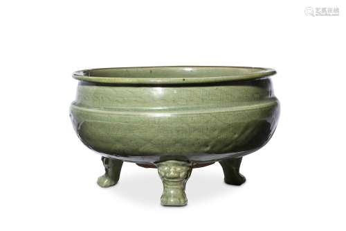 A CHINESE CELADON GLAZED TRIPOD INCENSE BURNER. Ming Dynasty. The rounded body supported on three