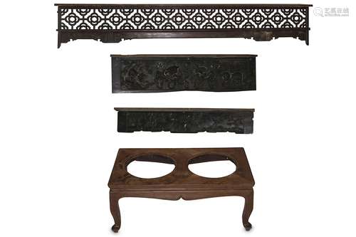 A CHINESE WOOD LOW TABLE. Late Qing Dynasty. With a rectangular top with two circular panels,