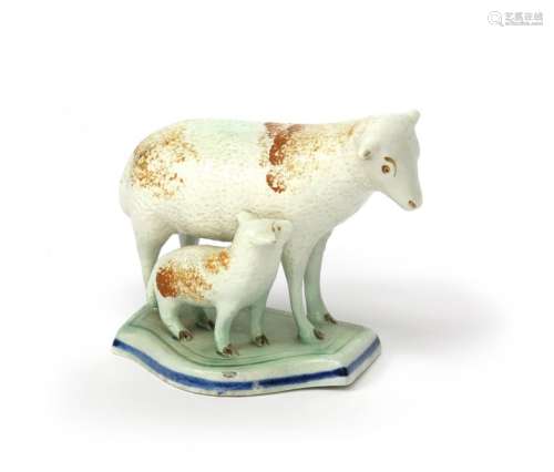 A pearlware figure group of a sheep and its lamb e...;