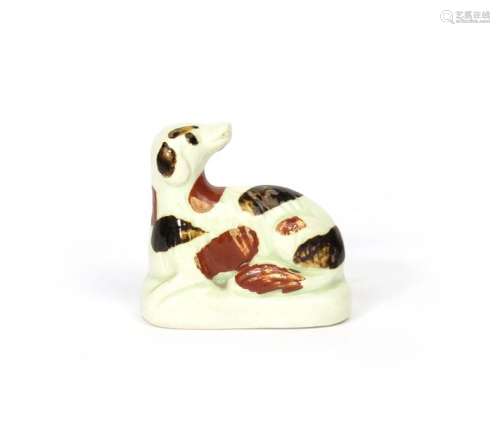 A small creamware figure of a dog early 19th centu...;