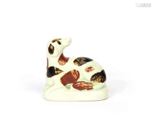 A small creamware figure of a dog early 19th centu...;