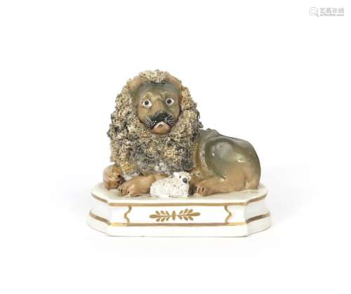 An English porcelain lion and lamb group c.1835, a...;