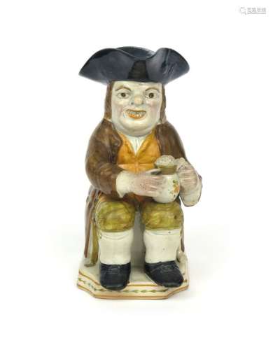 A pearlware Toby jug c.1790 1800, his small jug of...;