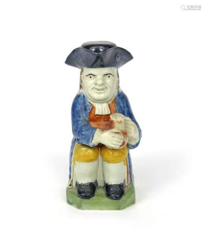 A Pratt ware Toby jug and cover c.1790 1800, seate...;