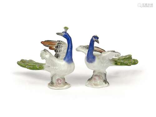 A pair of Meissen figures of peacocks 20th century...;