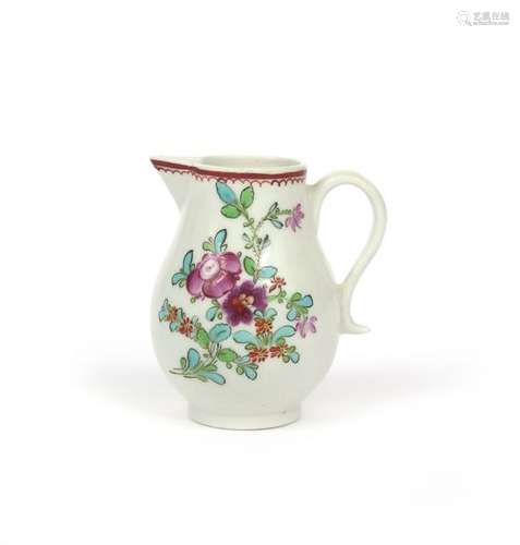 A Lowestoft milk jug c.1765 70, painted in polychr...;