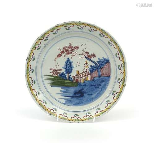 A Brislington delftware plate c.1710 20, painted i...;