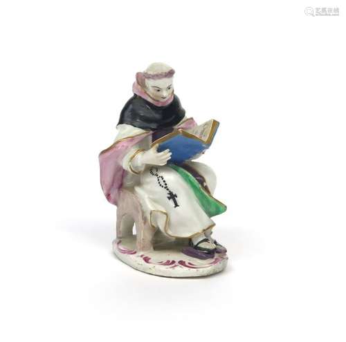 A Bow figure of a monk c.1760, seated on a low sto...;