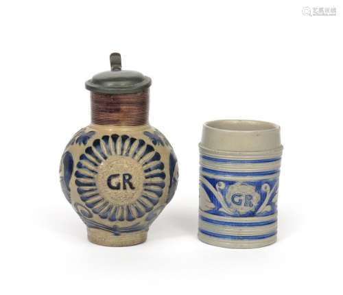 A Westerwald stoneware jug and a cylindrical mug c...;