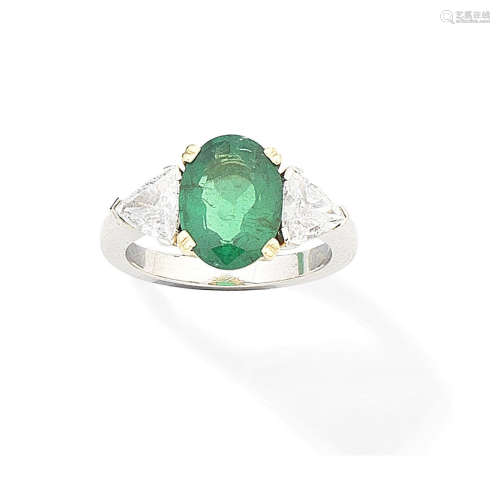 An emerald and diamond ring