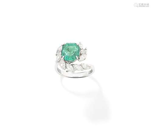 An emerald and diamond ring