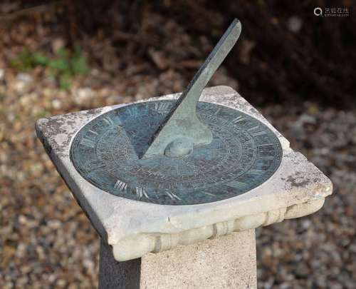 A fine patinated brass garden sundial with equation of time