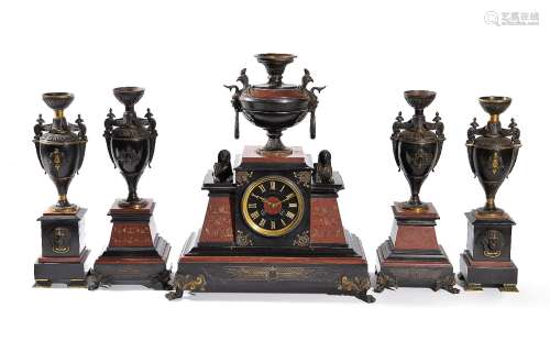 A French gilt and patinated bronze mounted marble five-piece mantel clock garniture in the Egyptian