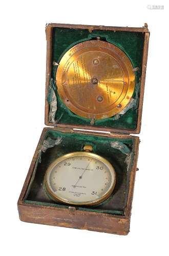 A gilt brass aneroid barometer and a brass weather forecasting calculator