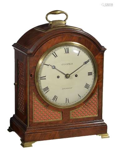 A Regency brass mounted figured mahogany bracket clock