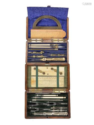 ϒ A walnut cased set of drawing instruments